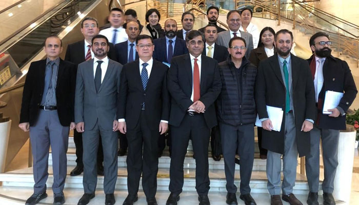 Minister of Commerce Dr Gohar Ejaz meets Chairman of the China Chamber of Commerce for Import and Export of Textiles (CCCT) Zhang Xinmin, and President of the COFCO Group Luan Richeng in China on Dec 11, 2023. — PID