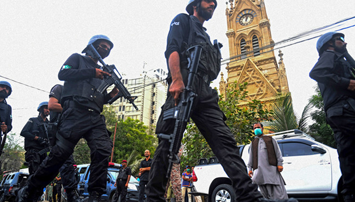 Sindh Police commandoes take a position in Karachi. — AFP/File