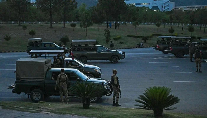 Army troops stand guard in the red zone after the arrest of former PM Imran Khan. — AFP/File