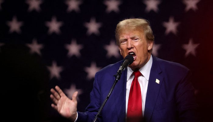 Former US President Donald Trump delivers remarks during a campaign rally at the Reno-Sparks Convention Center in Nevada on December 17, 2023. — AFP