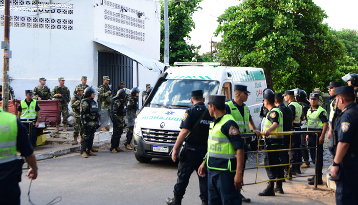 An ambulance transports an injured inmate out of the Tacumbu prison in Asuncion, on December 18, 2023.— AFP