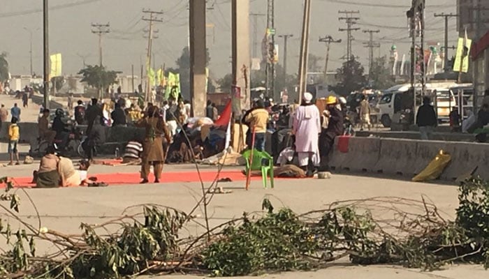 Protestors demonstrate at Faizabad interchange in Islamabad. — Online