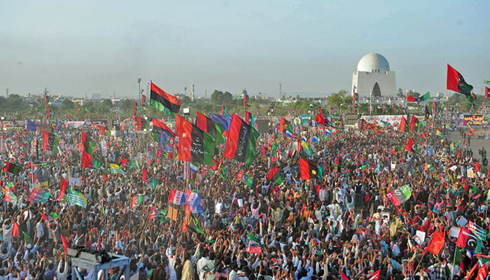 Supporters of Bilawal Bhutto Zardari, chairman of the PPP wave party flags during a rally in Karachi. — AFP/File