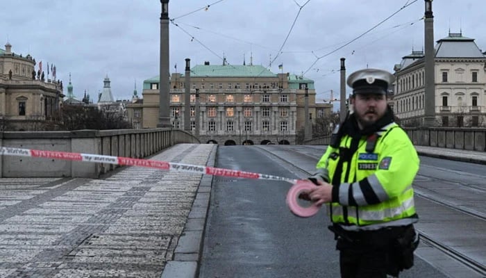 A police officer cordons off an area near Charles University in central Prague, on December 21, 2023. — AFP