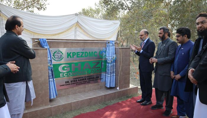 KP Caretaker Minister for Industries, Commerce Dr Syed Aamer Abdullah (c-R) prays during the inauguration of the Ghazi Economic Zone on December 22, 2023. — Facebook/Khyber Pakhtunkhwa Economic Zones Development and Management Company