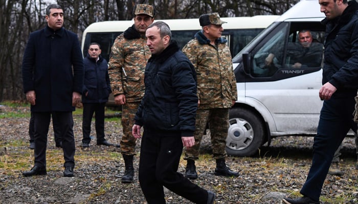 Armenian prisoners of war are seen during a swap at the Azerbaijani-Armenian state border on December 13, 2023. — AFP