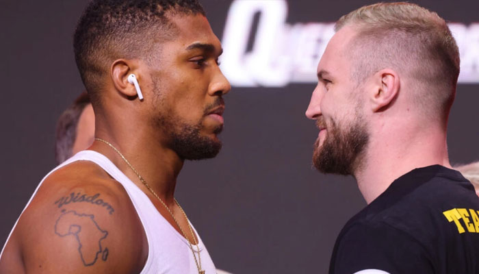 Britains Anthony Joshua (L) and Swedens Otto Wallin face off during a weigh-in for their heavyweight boxing bout in Riyadh. — AFP