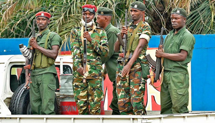 Burundi soldiers stand guard during a patrol. —  AFP