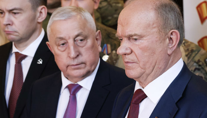 Communist Party leader Gennady Zyuganov (R) and State Duma member Nikolai Kharitonov attend a party congress, Dec. 23. — Tass