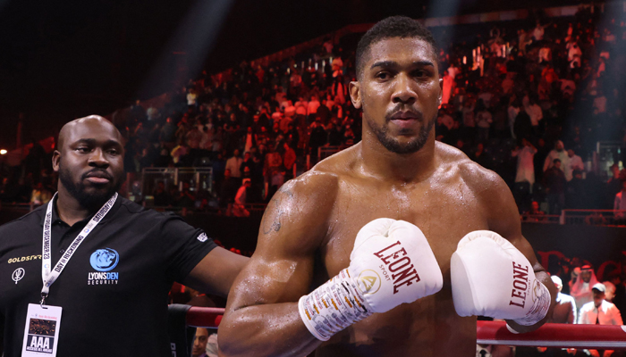 Britains Anthony Joshua celebrates after defeating Swedens Otto Wallin during their heavyweight boxing match at the Kingdom Arena in Riyadh on December 23, 2023. — AFP