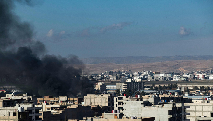 Smokes billows in northeastern Syria close to the Turkish border on December 25, 2023, amid military strikes in the area. — AFP