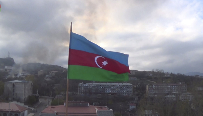 An Azerbaijani flag flies in the wind atop a building in the town of Shusha in the region of Nagorno-Karabakh, Azerbaijan. — AFP/File