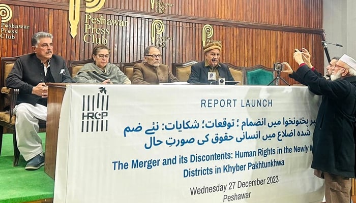 This image shows HRCP officials sitting on a stage during a report launch on December 27, 2023 in Peshawar. — Facebook/Human Rights Commission of Pakistan