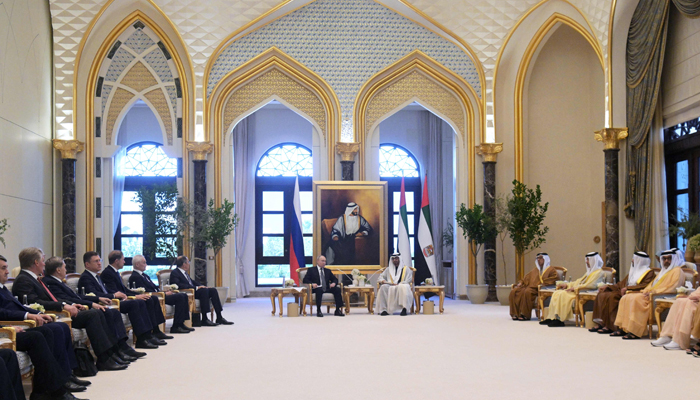 This photograph shows Russias President Vladimir Putin and President of the United Arab Emirates Sheikh Mohamed bin Zayed Al Nahyan holding a meeting in Abu Dhabi on December 6, 2023. — AFP