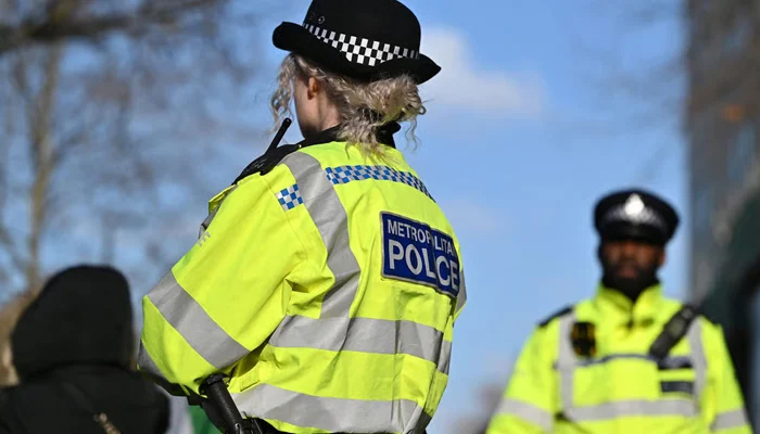 Police officials can be seen in this picture standing in London. — AFP/File