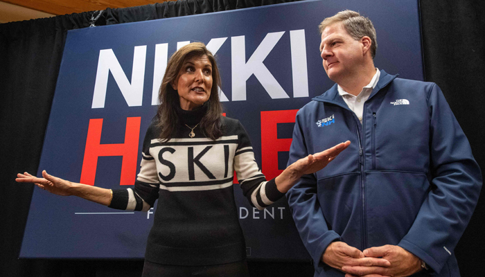 Former UN ambassador and 2024 Republican presidential hopeful Nikki Haley speaks to the press with New Hampshire Governor Chris Sununu at a town hall campaign event at Kennett High School in North Conway, New Hampshire, on December 28, 2023.— AFP