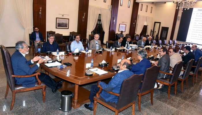 Sindh Caretaker Chief Minister Justice (retd) Maqbool Baqar presides over a meeting to finalise the development of a township at Taiser Town for the affected people of Gujjar, Mahmoodabad, and Orangi nullah at the CM House on Dec 28, 2023. — x/SindhCMHouse