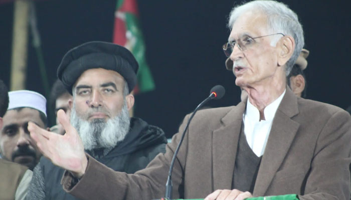 The image released on Dec 24, 2023 shows Pervez Khattak addressing a workers convention in Nowshera. — Facebook/CMKPOfficial