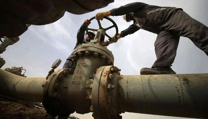 Two employees while working on a gas pipeline in an unidentified location. — AFP/File