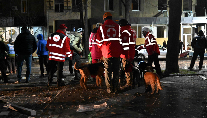 Rescuers are at work in Kharkiv outside the destroyed building following a Russian missile strike, amid the Russian invasion of Ukraine on December 30, 2023. — AFP