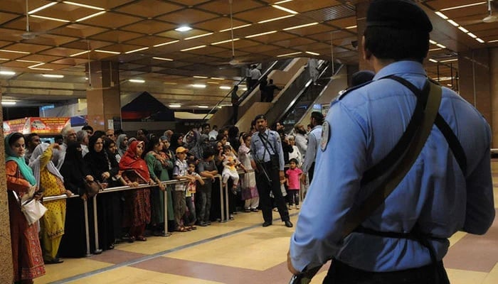 This picture shows Pakistani Airports Security Force personnel standing guard at Jinnah International Airport in Karachi. — AFP/File