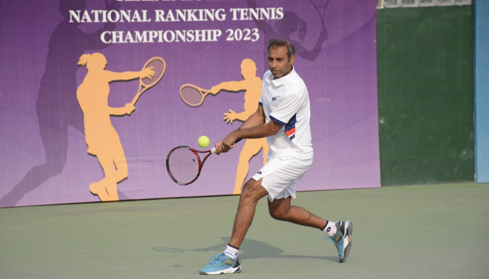 Pakistans ace tennis player Aqeel Khan while taking a shot during the Serena Tennis men’s single’s title at the PTF/SDA Complex Courts on December 31, 2023. — Facebook/Pakistan Tennis Federation