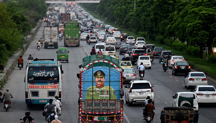 Commuters on the road in Islamabad, Pakistan, on August 16, 2023. — AFP