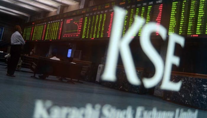 A stockbroker monitors the share prices during a trading session at the Pakistan Stock Exchange (PSX) in Karachi. — AFP/File