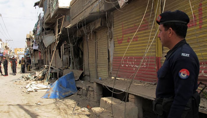 Pakistani police officials inspect the site of a bomb explosion in the city of Dera Ismail Khan in Khyber Pakhtunkhwa.—AFP/File