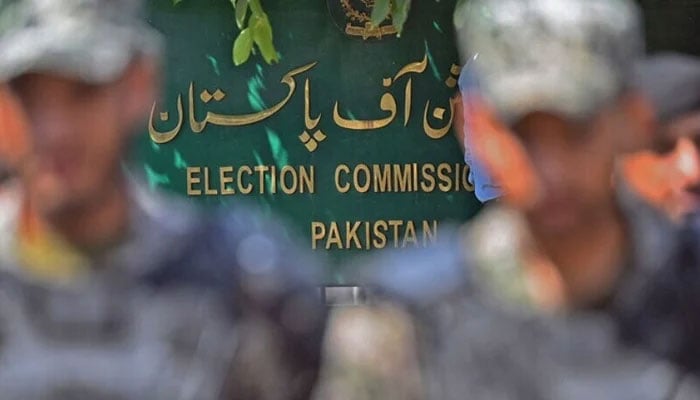 Paramilitary soldiers stand guard outside the Pakistan’s election commission building in Islamabad on August 2. — AFP/File