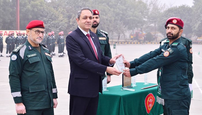 In this image The Secretary Emergency Services Department (ESD) Dr Rizwan Naseer congratulates best performing rescuers.—Facebook/Punjab Emergency Service Department