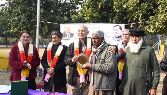 Senator Mushahid Hussain can be seen in this image hosting a Christmas party for sanitary workers on January 03, 2024.—APP