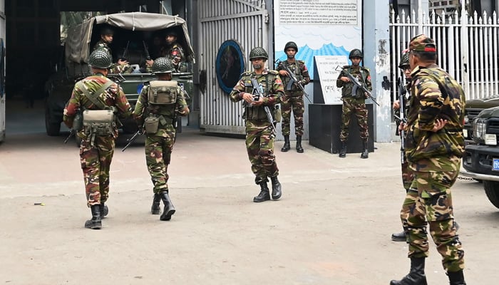 Bangladesh Army personnel gather at the Sheikh Russel Roller Skating Complex in Dhaka on January 3, 2024, after a nationwide deployment of armed forces to ensure security ahead of the upcoming January 7 national election. — AFP