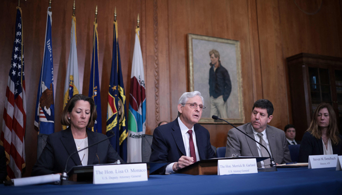 Attorney General Merrick Garland (2nd R) delivers remarks regarding ongoing efforts by the Department of Justice to combat violent crime and a reported decrease in violent crime seen in many cities during the previous year January 5, 2024, in Washington, DC. — AFP