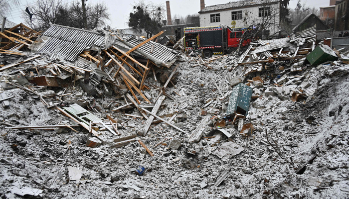 This photograph taken on January 8, 2024, shows a crater following Russian strikes, in Zmiiv, Kharkiv region. — AFP