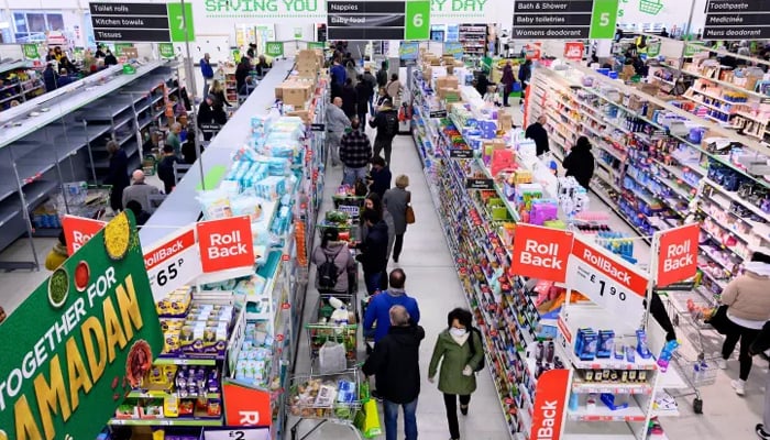 This image shows people in a supermarket in the UK. — AFP/File