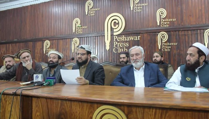 General Secretary Rah-e-Haq Party Ibrahim Qasimi speaks during a joint press conference with the district president of JI Bahrullah Khan Advocate (L) at the Peshawar Press Club on January 11, 2024. — Facebook/Pakistan Rah-e-Haq Party Official