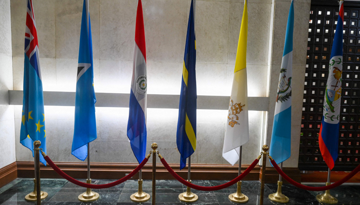 The national flag of Nauru (C) is seen among flags at Taiwans Ministry of Foreign Affairs in Taipei on January 15, 2024. — AFP