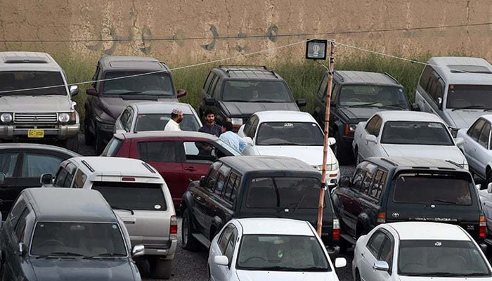 Multiple vehicles can be seen parked in this image. — AFP/File