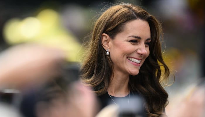 Britains Catherine, Princess of Wales reacts as she speaks to members of the public outside Norwich Gate on the Sandringham Estate in Sandringham, eastern England, on September 15, 2022, following the death of Queen Elizabeth II. — AFP