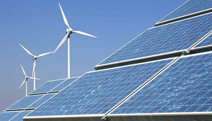 This image shows solar panels and wind turbines. — AFP/File