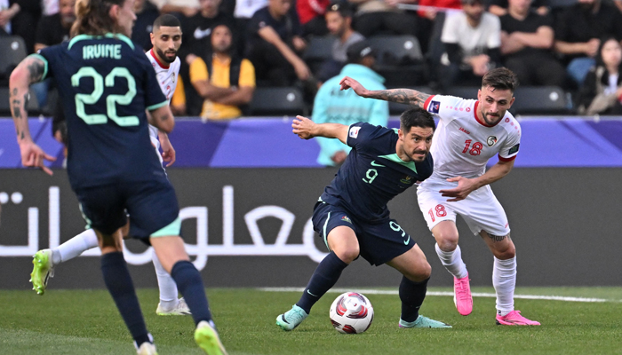 Syrias Jalil Elias vies for the ball against Australias Bruno Fornaroli during the Qatar 2023 AFC Asian Cup Group B football match at the Jassim bin Hamad Stadium in Doha on January 18, 2024. — AFP