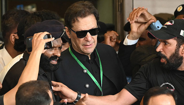 Former Pakistan Tehreek-e-Insaf (PTI) chairman Imran Khan leaves after appearing in the Supreme Court in Islamabad on July 24, 2023. — AFP