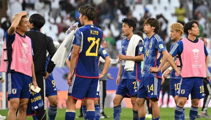 Japans players react at the end of the Qatar 2023 AFC Asian Cup Group D football match between Iraq and Japan at the Education City Stadium in Al-Rayyan, west of Doha on January 19, 2024. — AFP