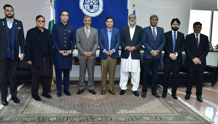 President Islamabad Chamber of Commerce and Industry (ICCI) Ahsan Zafar Bakhtawari (C) and (NUST) management pose at the National University of Science and Technology (NUST) on January 20, 2024. — Facebook/Ahsan Bakhtawari official