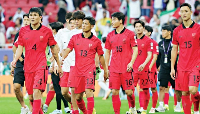 South Korean players walk on the pitch after their 2023 AFC Asian Cup match against Jordan in Doha, Qatar on January 20, 2024. — AFP