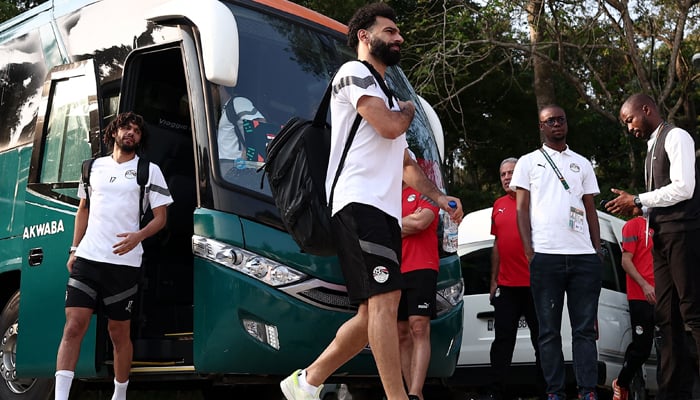 Mohamed Salah (C) arrives for a training session at Jardin Botanique stadium in Bingerville, Abidjan on January 21, 2024. — AFP