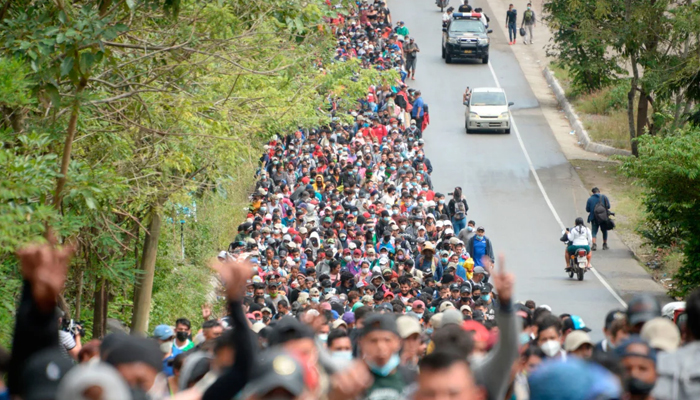 Honduran migrants walk along a road in Camotan, Guatemala. — AFP/File