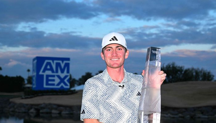 American Nick Dunlap with the trophy after winning The American Express at Pete Dye Stadium Course. AFP/File