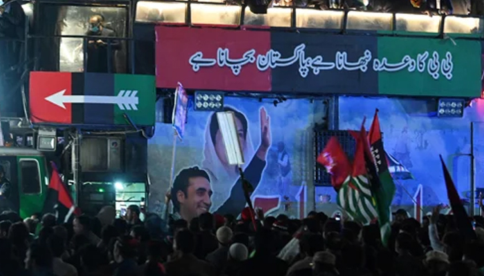 Supporters of the Pakistan-Peoples Party (PPP)  gathered around a truck. — AFP/File